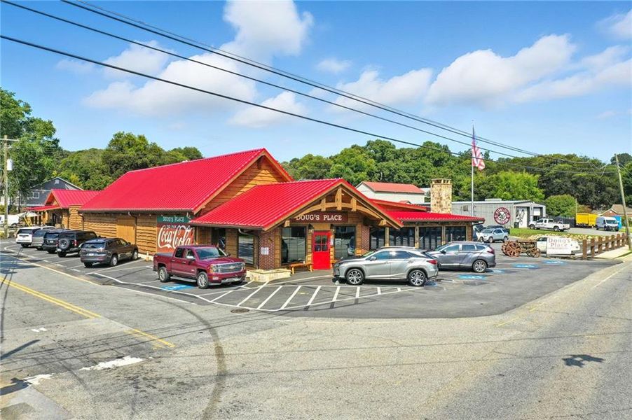 Front exterior of a new home in Ferguson Corners, Emerson, GA, highlighting curb appeal (Image 1).