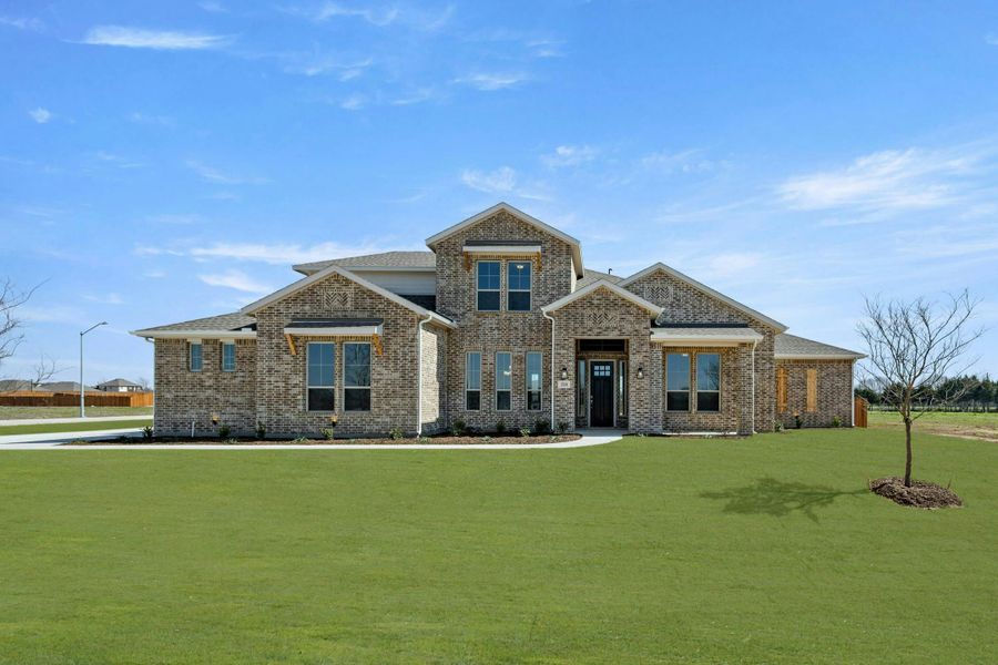 Representative exterior photo of a completed home built from the Reid by Kindred Homes in Heritage, McLendon-Chisholm, TX (Image 22). Representative exterior photo of a completed home built from the Reid by Kindred Homes in Heritage, McLendon-Chisholm, TX (Image 22).