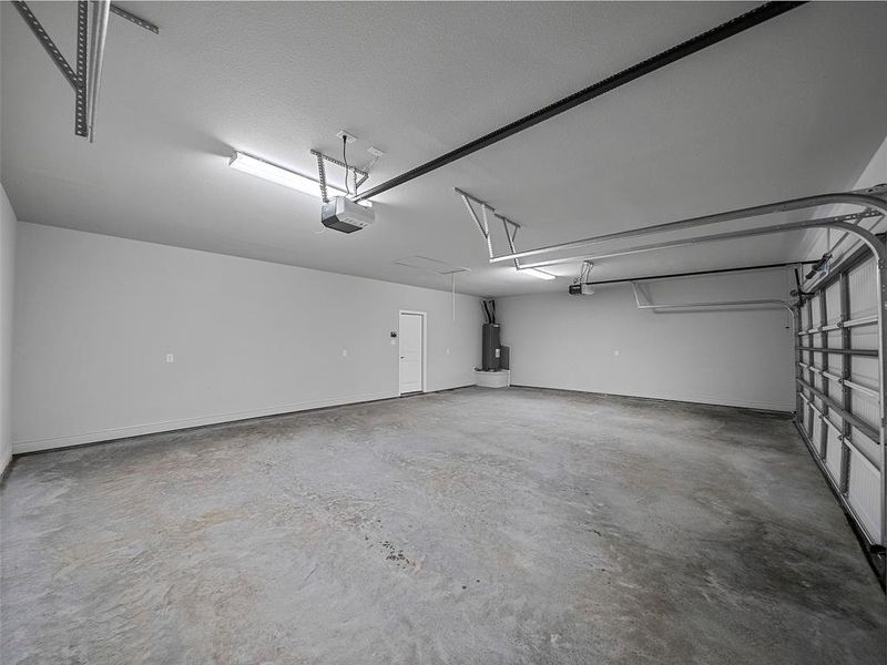 Garage with water heater and a garage door opener Garage with water heater and a garage door opener