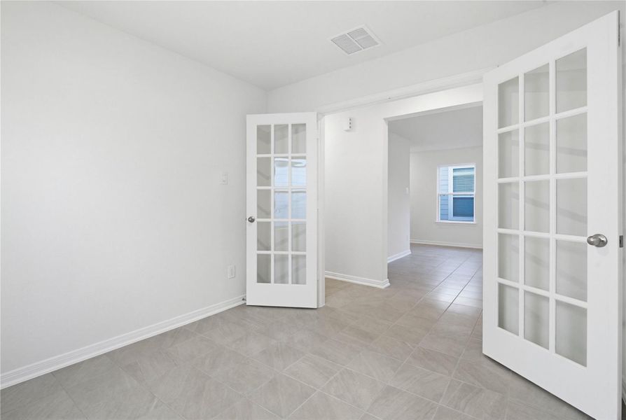 Additional view from Den to the hallway leading to the secondary bedrooms and bathroom. Note the gorgeous French Doors to this Den.