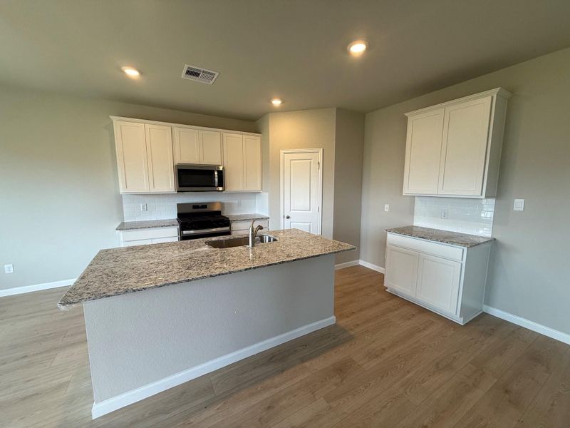 Furnished interior view inside a new home in Midtown Reserve, College Station (Image 5).