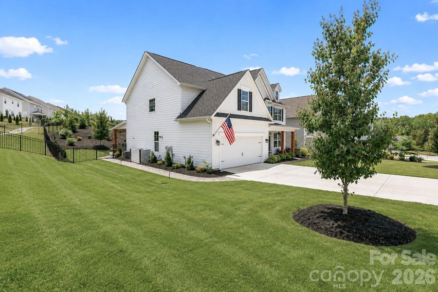 Front exterior of a new home in Falls Cove, Troutman, NC, highlighting curb appeal (Image 20).