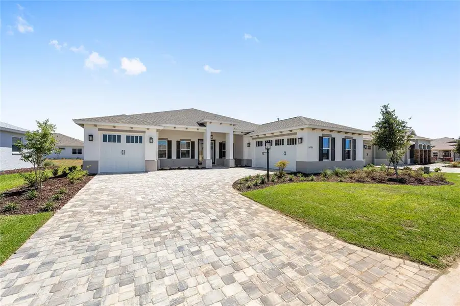 Front exterior of a new home in , Ocala, FL, highlighting curb appeal (Image 1). Front exterior of a new home in , Ocala, FL, highlighting curb appeal (Image 1).