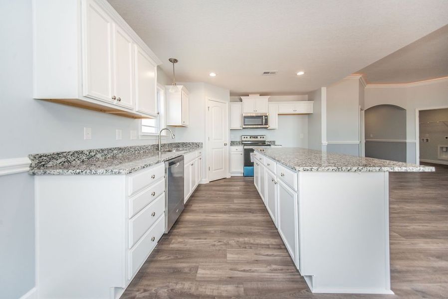 Representative furnished interior of a home built from the Franklin by Enchanted Homes in Guadalupe Heights, Seguin (Image 10).