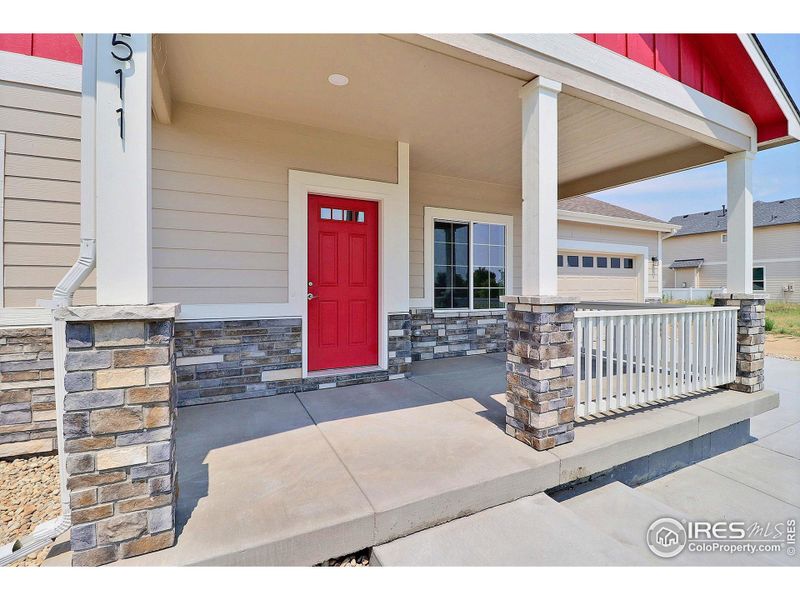 Front exterior of a new home in , Evans, CO, highlighting curb appeal (Image 21).