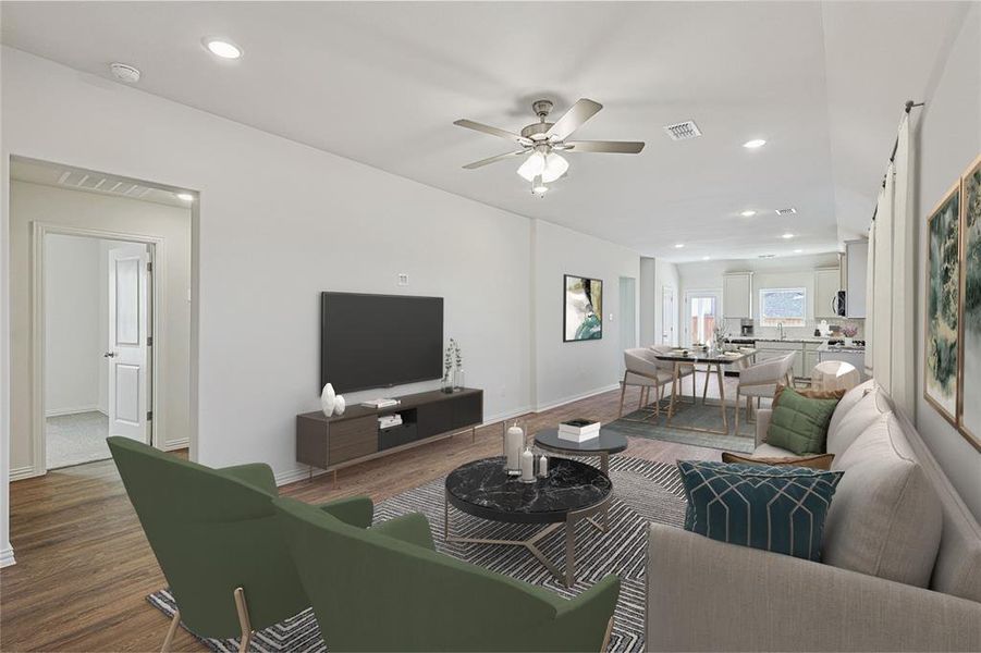 Living area featuring dark wood-style flooring, a ceiling fan, recessed lighting, and baseboards Living area featuring dark wood-style flooring, a ceiling fan, recessed lighting, and baseboards