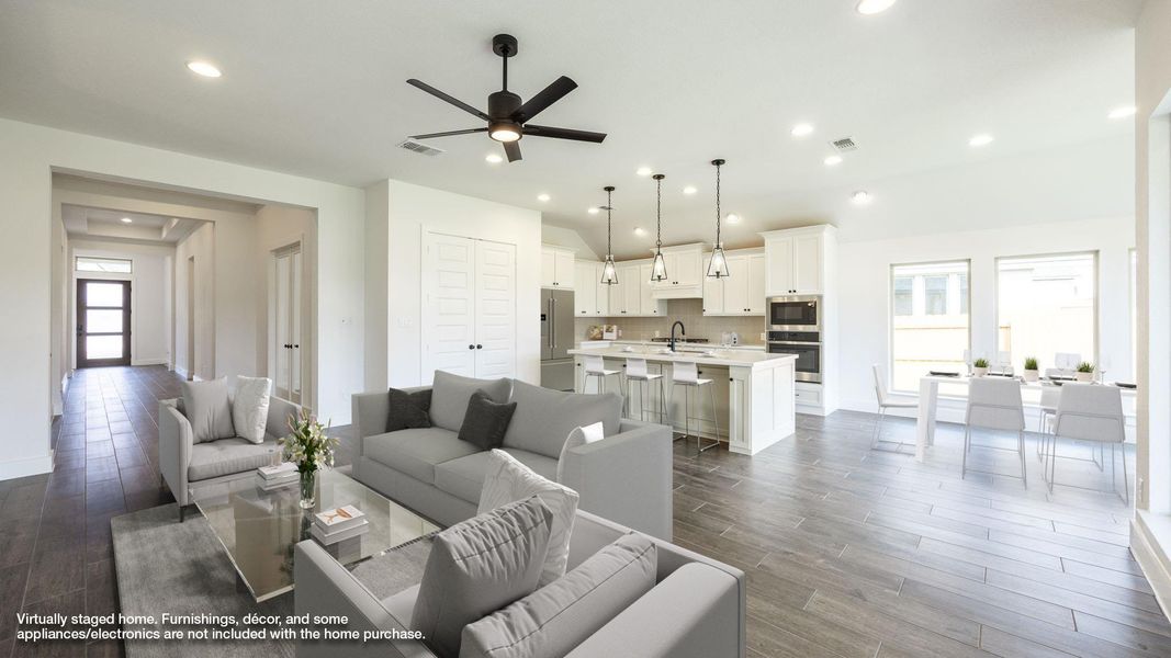 Living room featuring a ceiling fan, dark wood finished floors, lofted ceiling, and recessed lighting