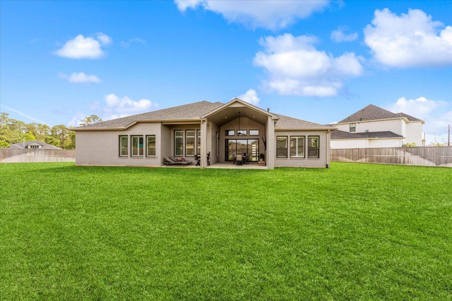 The oversized backyard offers endless possibilities for creating your dream outdoor oasis.