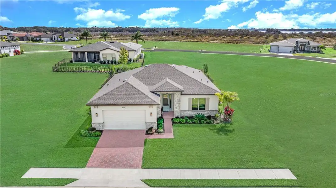 Front exterior of a new home in , Auburndale, FL, highlighting curb appeal (Image 22).