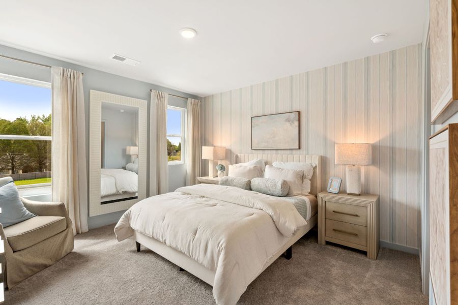 A bedroom with a large bed. A bedroom with a large bed.