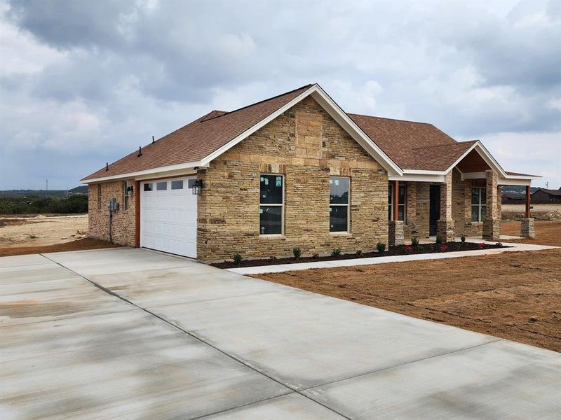 Front exterior of a new home in , Nemo, TX, highlighting curb appeal (Image 2). Front exterior of a new home in , Nemo, TX, highlighting curb appeal (Image 2).