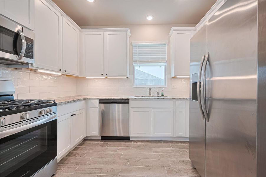 Furnished interior view inside a new home in Sunterra, Katy (Image 15).