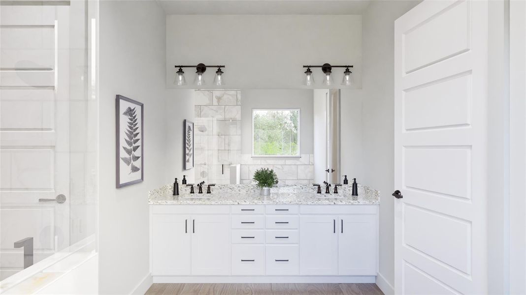 The master bathroom has a dual sink vanity, step-in shower and seperate bathtub.