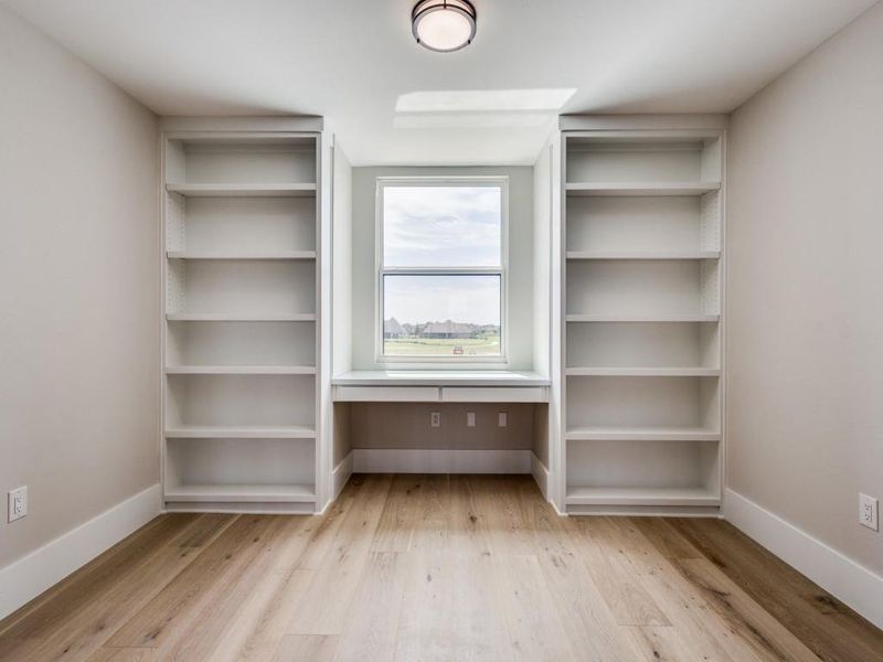 Upstairs Desk -Study Area with custom build in desk with glass top  and built in custom bookshelves
