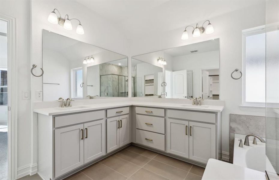 Private owner's bathroom with dual vanity *real home pictured