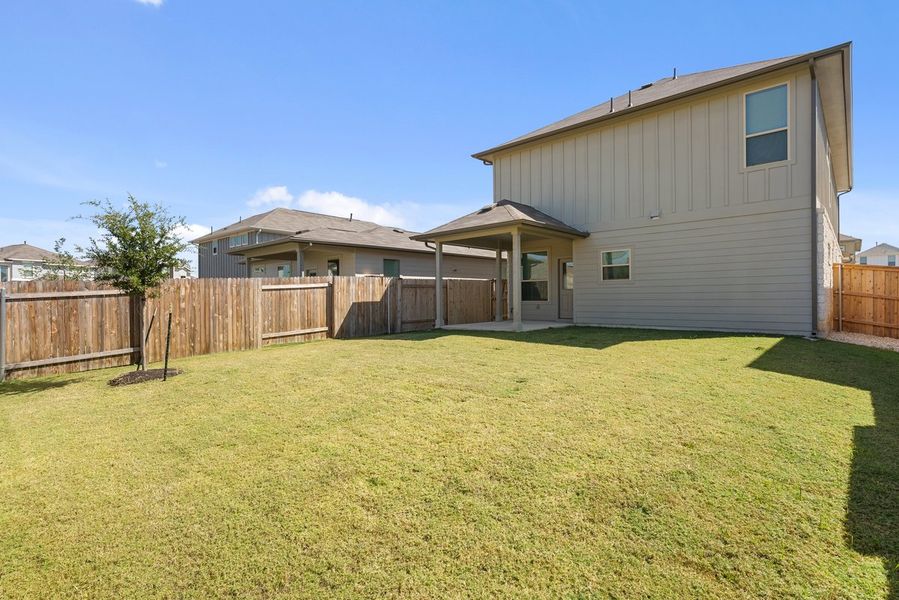 Exterior details and patio area of a home in Crosswinds, Kyle (Image 15).