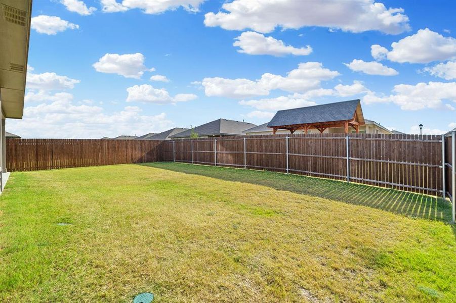 View of fenced backyard