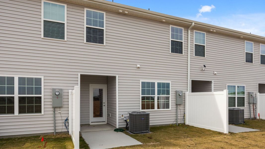 Exterior details and patio area of a home in The Townes at Ridgewood Farms, Winterville (Image 18). Exterior details and patio area of a home in The Townes at Ridgewood Farms, Winterville (Image 18).