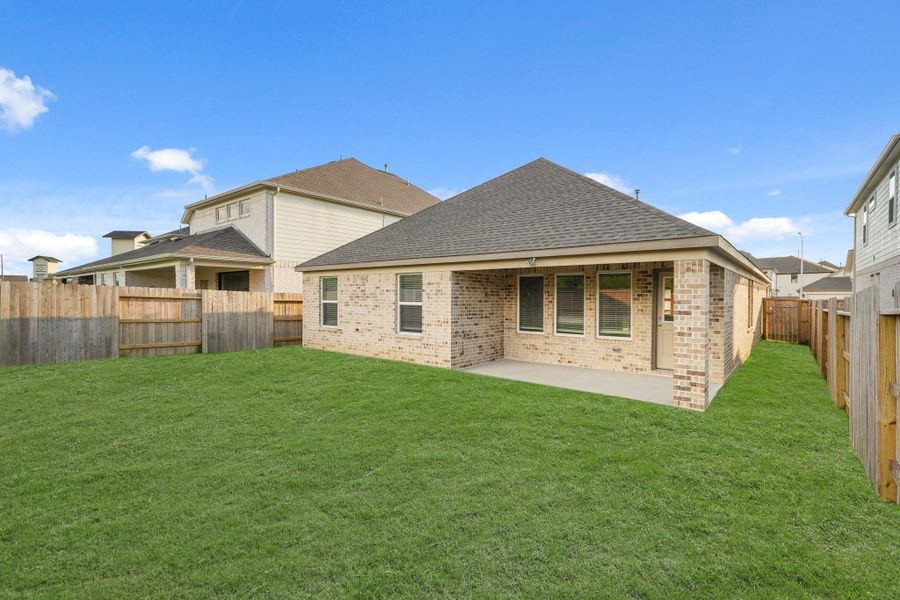 Front exterior of a new home in Sunterra North, Katy, TX, highlighting curb appeal (Image 7). Front exterior of a new home in Sunterra North, Katy, TX, highlighting curb appeal (Image 7).