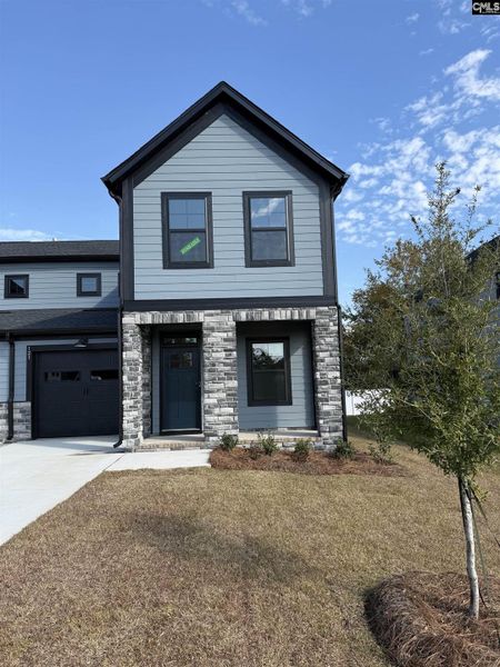 Front exterior of a new home in Dunbar Village, Cayce, SC, highlighting curb appeal (Image 2).