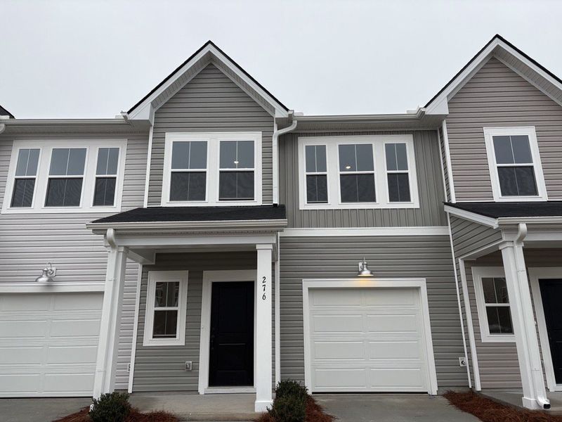 Front exterior of a new home in Limehouse Farms, Summerville, SC, highlighting curb appeal (Image 1). Front exterior of a new home in Limehouse Farms, Summerville, SC, highlighting curb appeal (Image 1).