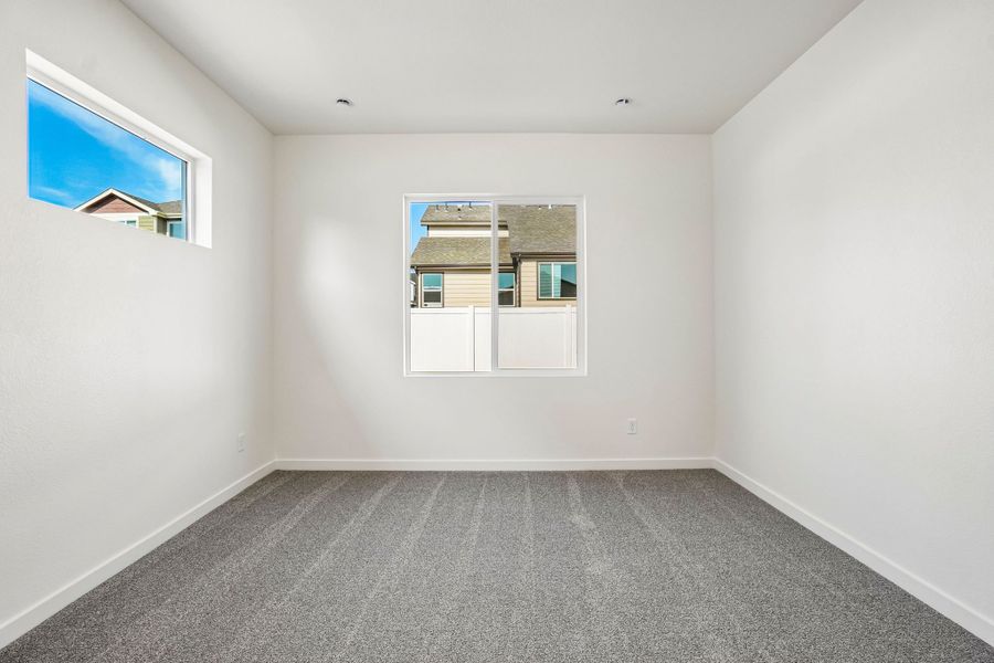 Spacious, unfurnished interior of a new home in Union Colony West, Greeley (Image 38).