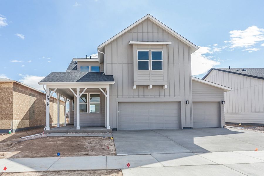 Front exterior of a new home in Trailside, Timnath, CO, highlighting curb appeal (Image 2). Front exterior of a new home in Trailside, Timnath, CO, highlighting curb appeal (Image 2).