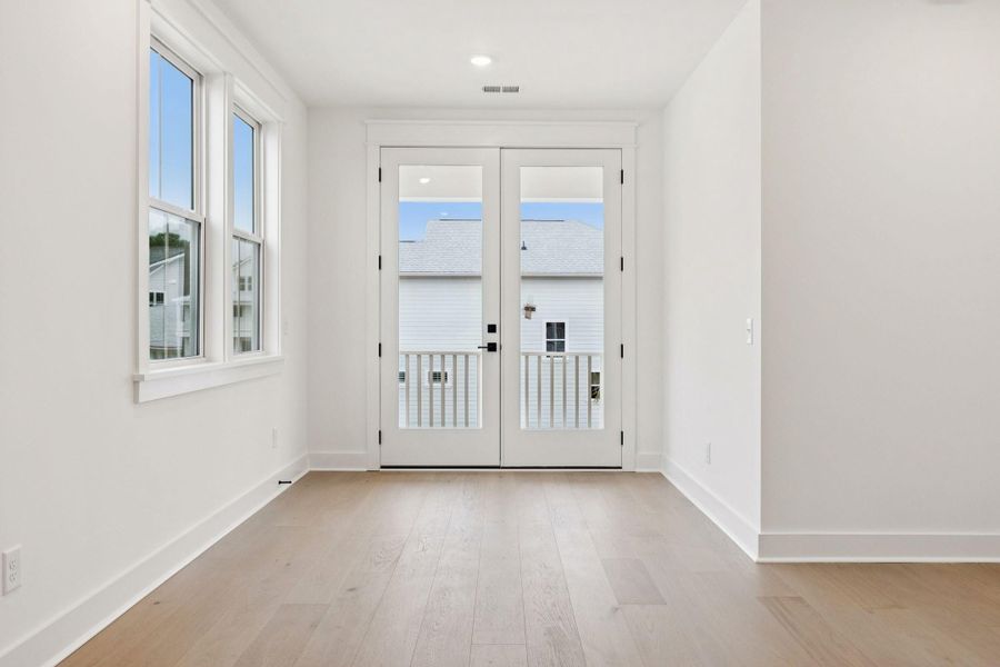 Spacious, unfurnished interior of a new home in Overlook at Copahee Sound, Awendaw (Image 42).