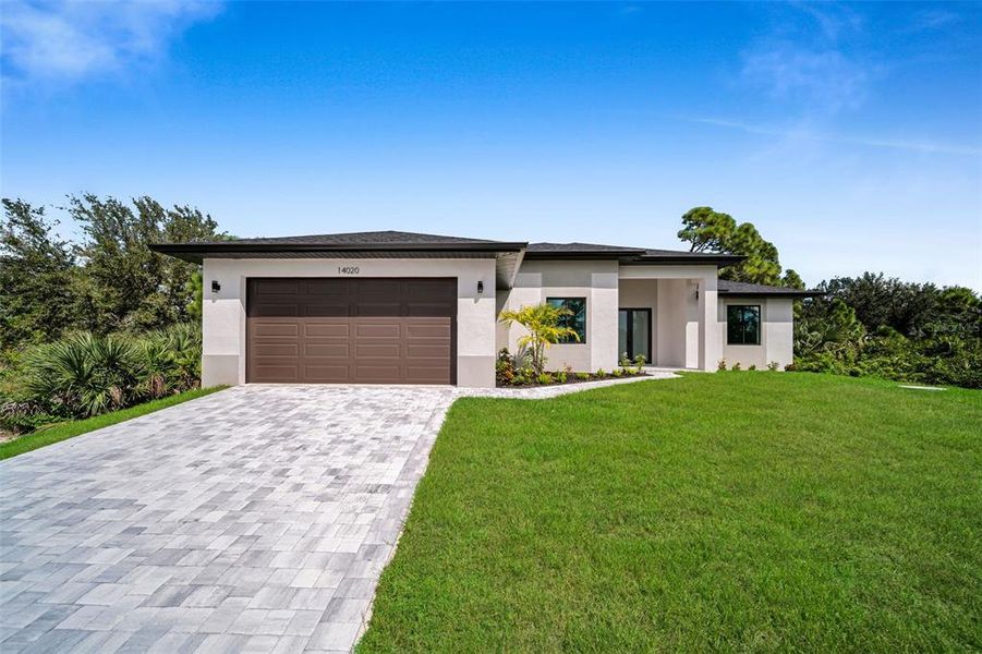 Front exterior of a new home in , Port Charlotte, FL, highlighting curb appeal (Image 1). Front exterior of a new home in , Port Charlotte, FL, highlighting curb appeal (Image 1).