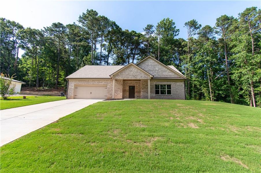 Front exterior of a new home in , Canton, GA, highlighting curb appeal (Image 1). Front exterior of a new home in , Canton, GA, highlighting curb appeal (Image 1).