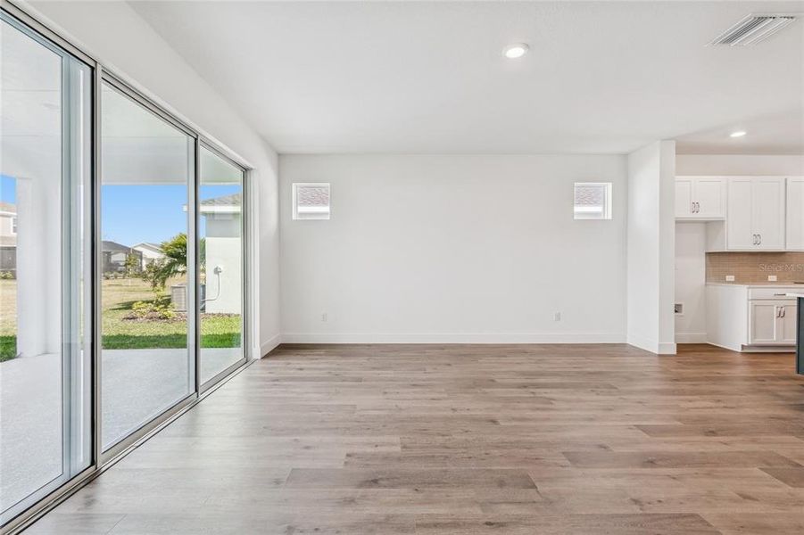 Spacious, unfurnished interior of a new home in North River Ranch - Cottage Series, Parrish (Image 11).