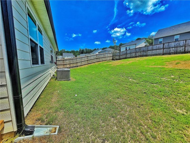 Exterior details and patio area of a home in Oakchase at Hampton, Hampton (Image 30).