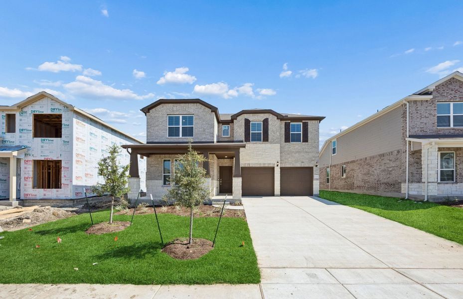 Front exterior of a new home in Lagos, Manor, TX, highlighting curb appeal (Image 18).