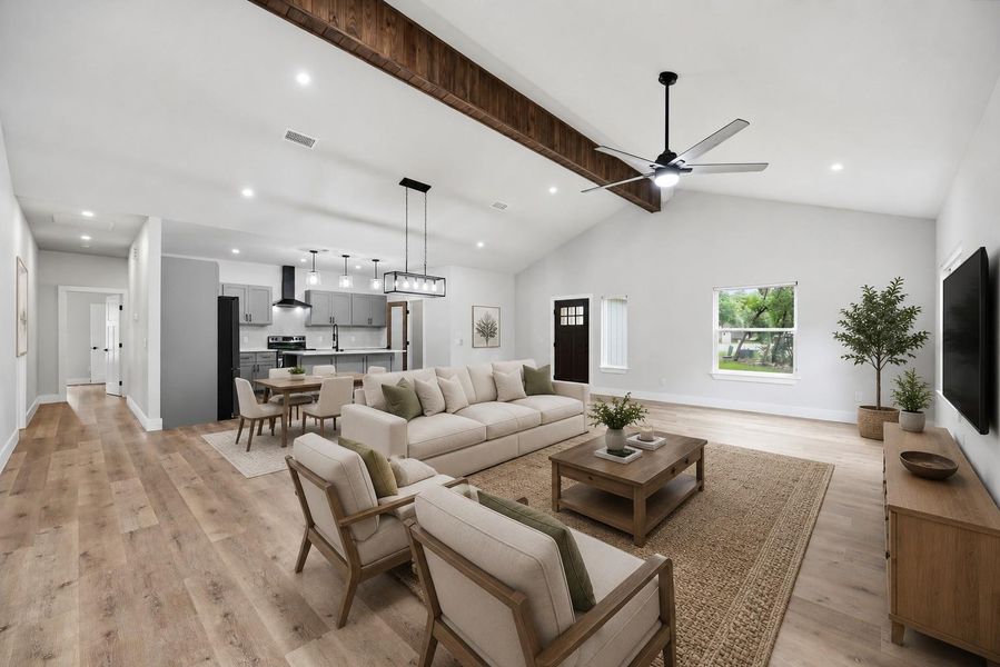 Vast vaulted ceilings and recessed lighting define this inviting, open-concept living space. Vast vaulted ceilings and recessed lighting define this inviting, open-concept living space.