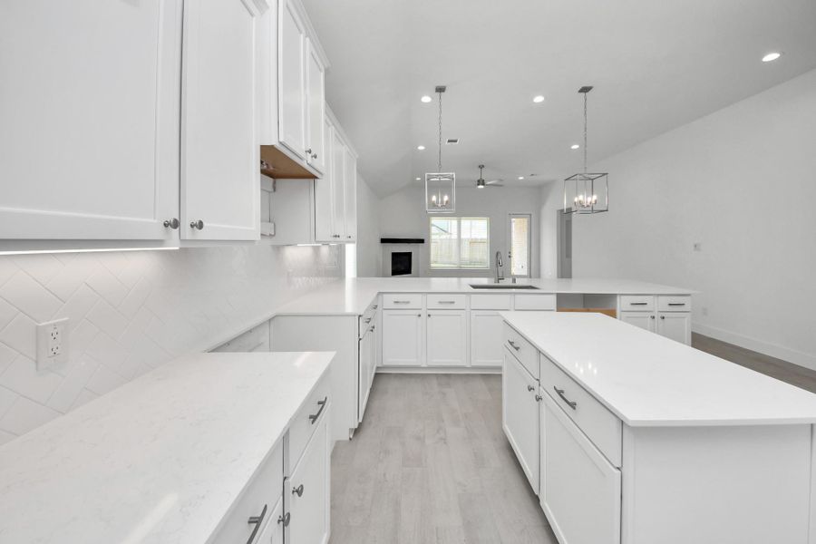 All of this overlooks your expansive family room, creating a perfect space for culinary delights and family gatherings.