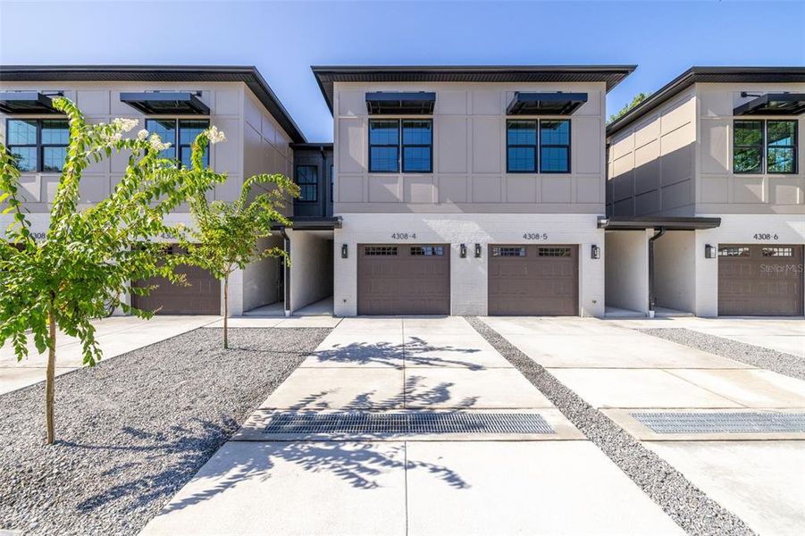 Front exterior of a new home in , Tampa, FL, highlighting curb appeal (Image 27).