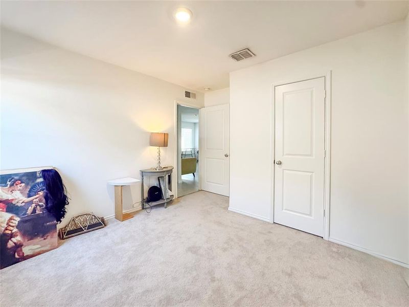 Bedroom featuring carpet flooring and baseboards
