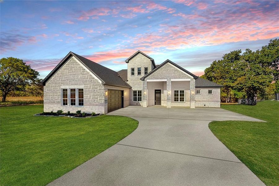 Front exterior of a new home in , Springtown, TX, highlighting curb appeal (Image 2).