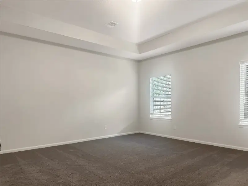 The Crawford- Primary Bedroom. Home is under construction, photos used for illustration only; actual features, colors, and upgrades may vary.