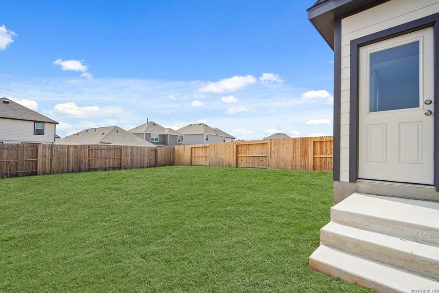 Exterior details and patio area of a home in Hickory Ridge, Elmendorf (Image 19).