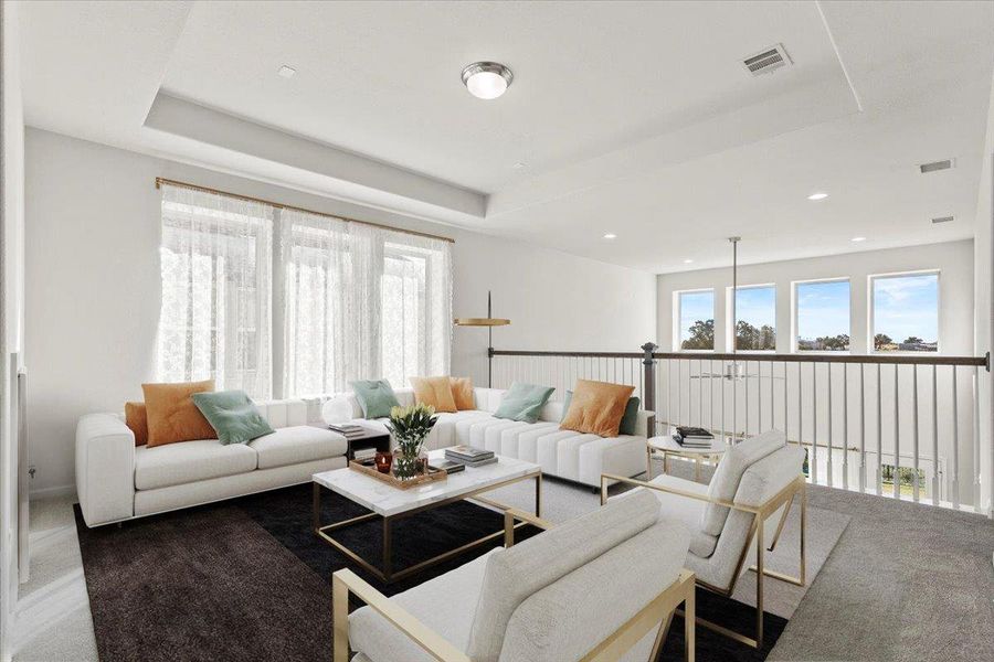 Living area featuring carpet floors and a raised ceiling with open-to-below feature upstairs. Virtual Staging Added. Living area featuring carpet floors and a raised ceiling with open-to-below feature upstairs. Virtual Staging Added.