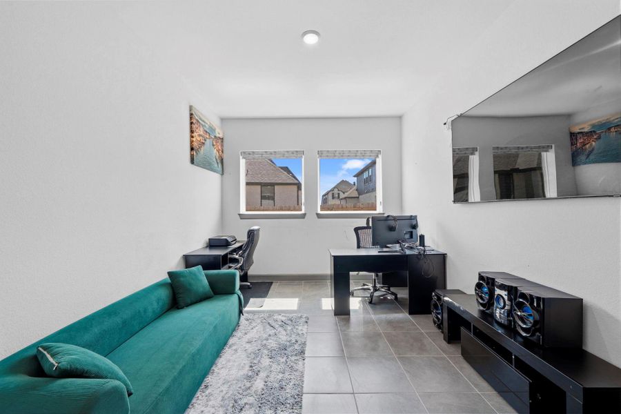 Private home office with large windows for natural light and flexible layout—ideal for remote work, study, or creative space.