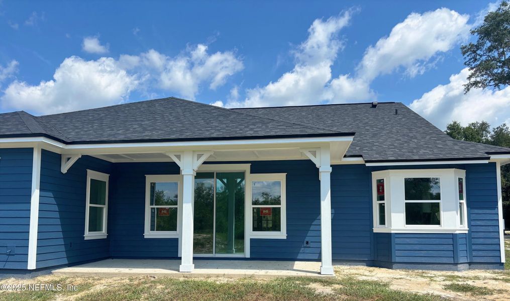 Front exterior of a new home in , Melrose, FL, highlighting curb appeal (Image 13).