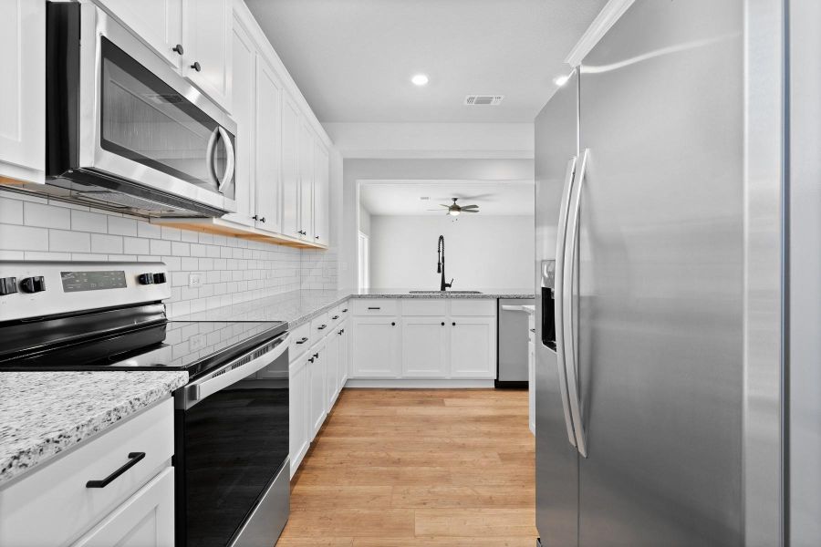 Furnished interior view inside a new home in Whisper Valley, Manor (Image 4).