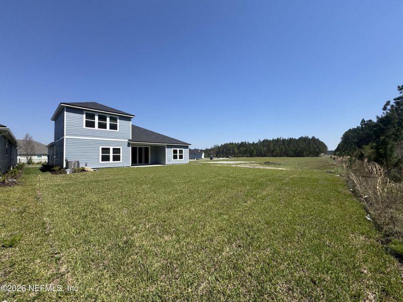 Exterior details and patio area of a home in Hyland Trail, Green Cove Springs (Image 4).