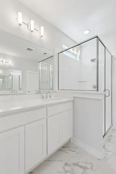 Primary Bathroom in the Masters home plan by Trophy Signature Homes – REPRESENTATIVE PHOTO Primary Bathroom in the Masters home plan by Trophy Signature Homes – REPRESENTATIVE PHOTO