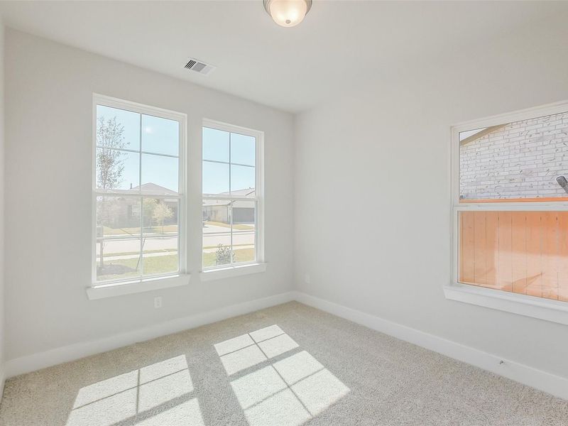 Spacious, unfurnished interior of a new home in Sunterra, Katy (Image 37).