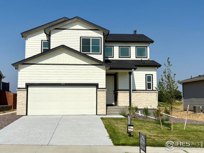 Front exterior of a new home in Promontory Point, Greeley, CO, highlighting curb appeal (Image 1). Front exterior of a new home in Promontory Point, Greeley, CO, highlighting curb appeal (Image 1).
