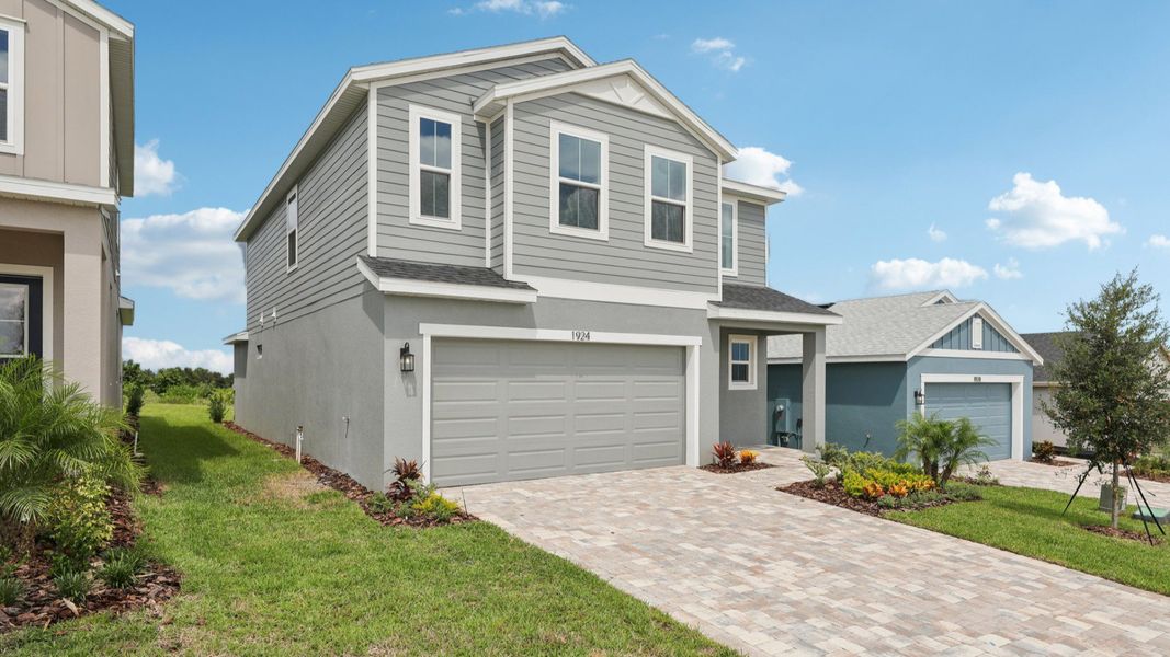 Representative exterior photo of a completed home built from the Naples by DRB Homes in Willowbrook North, Winter Haven, FL (Image 28).