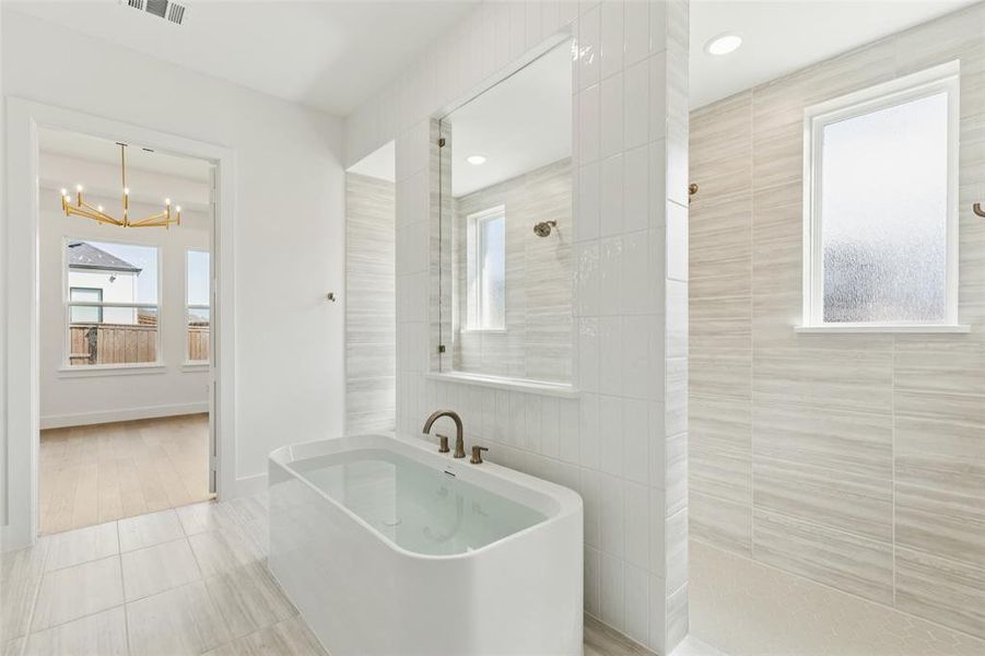 Featuring a walk through double shower, drying space and a free standing tub, this owner's bath is one for the ages!
